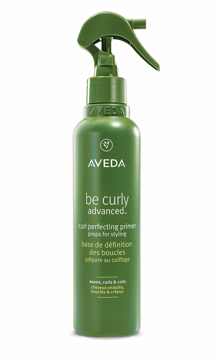 Aveda Be Curly Advanced curl perfecting primer spray bottle in green with a green spray trigger