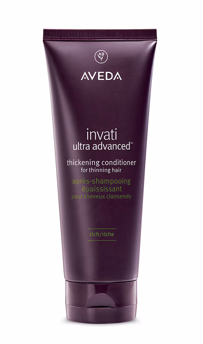 Aveda Invati Ultra Advanced thickening conditioner tube in maroon, designed for thinning hair