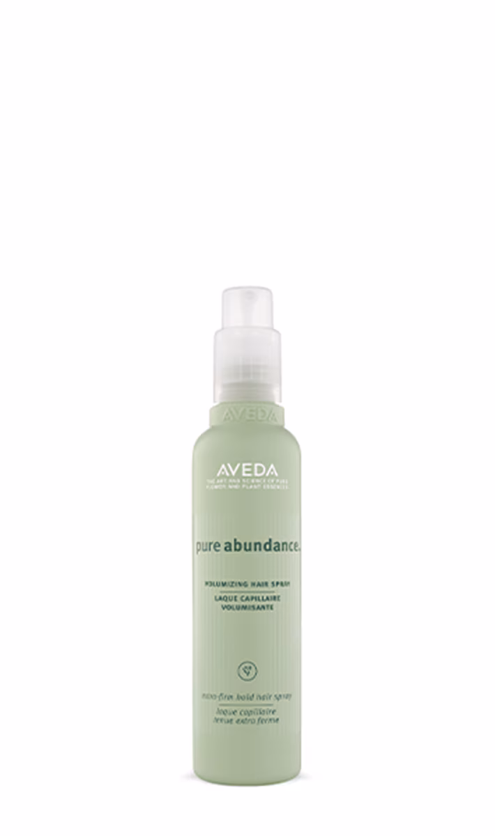 Aveda Pure Abundance volumizing hair spray bottle in green with a white spray nozzle