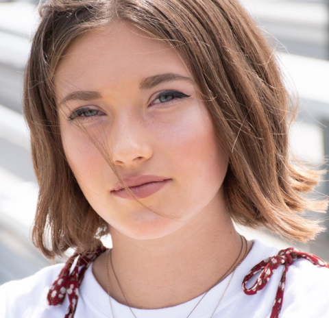 Sleek, chin-length bob hairstyle with subtle waves